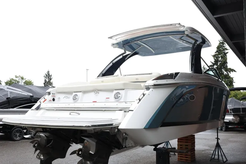 Slide: The Image of 2021 Cobalt R30 boat with sleek design on display in a showroom. - 13