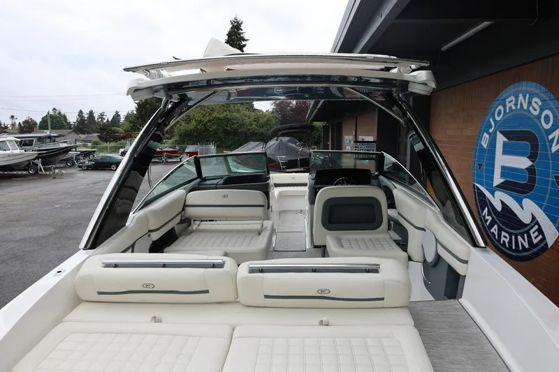 Slide: The Image of 2021 Cobalt R30 boat interior with white seating at Bjornson Marine dealership. - 24
