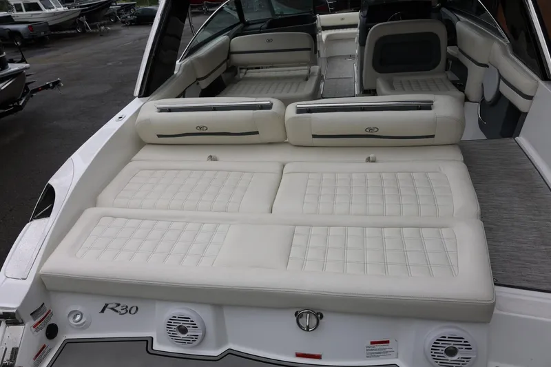 Slide: The Image of 2021 Cobalt R30 boat interior with spacious white seating and modern design. - 25