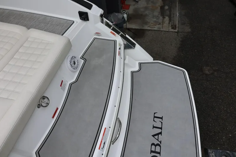 Slide: The Image of 2021 Cobalt R30 boat deck with cushioned seating and non-slip surface. - 27