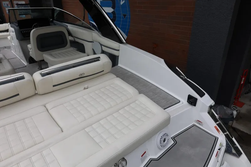 Slide: The Image of 2021 Cobalt R30 boat interior with luxurious white seating and modern design. - 28