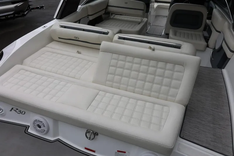 Slide: The Image of Luxurious interior of a 2021 Cobalt R30 boat with plush white seating. - 30