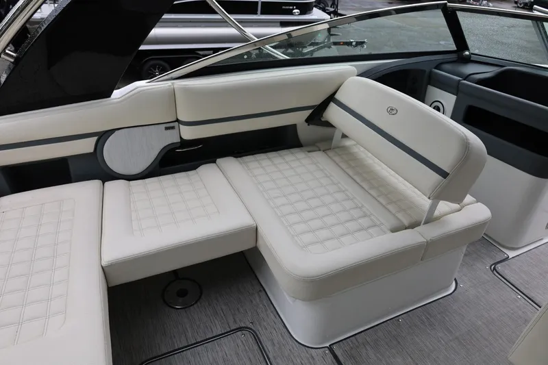 Slide: The Image of Luxurious seating area in a 2021 Cobalt R30 boat, featuring elegant white upholstery. - 32