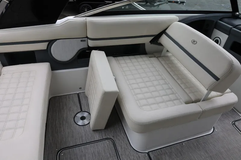 Slide: The Image of 2021 Cobalt R30 boat interior with beige cushioned seating and modern design. - 33