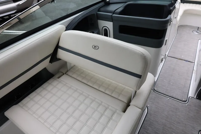 Slide: The Image of 2021 Cobalt R30 boat interior with white cushioned seating and sleek design. - 36
