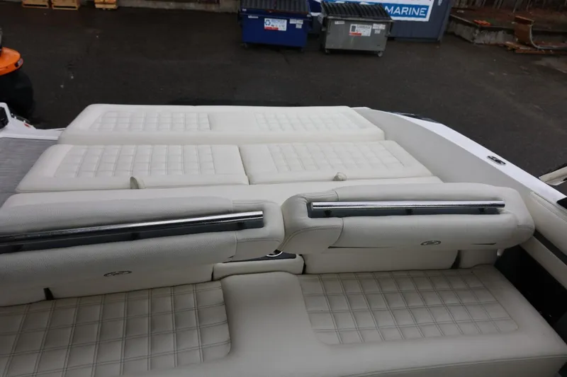 Slide: The Image of 2021 Cobalt R30 boat interior with white cushioned seating and sleek design. - 38