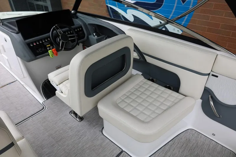 Slide: The Image of Interior of 2021 Cobalt R30 boat featuring modern helm and luxurious seating. - 40