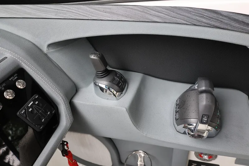Slide: The Image of Control panel of a 2021 Cobalt R30 boat, featuring modern joystick and throttle controls. - 47