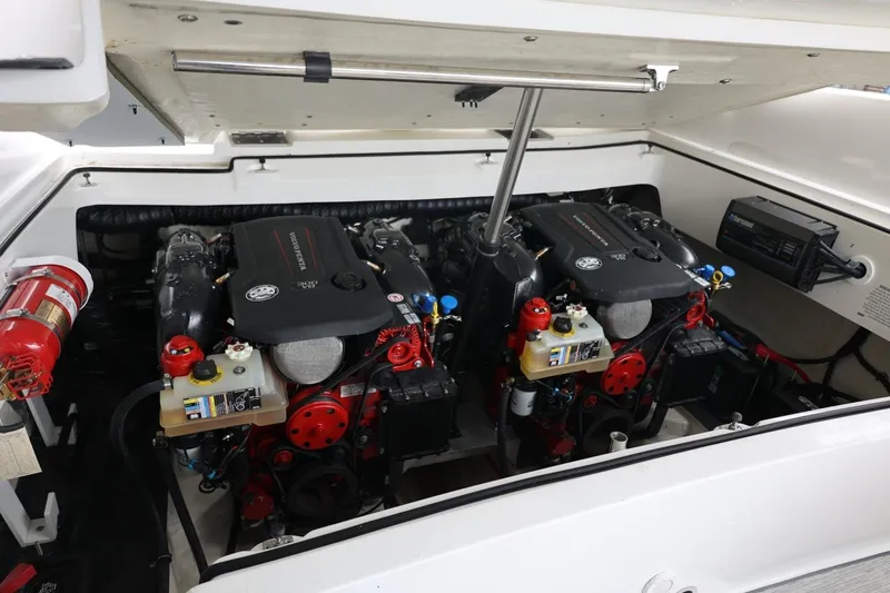 Slide: The Image of Engine compartment of a 2021 Cobalt R30 boat, featuring dual inboard engines. - 56
