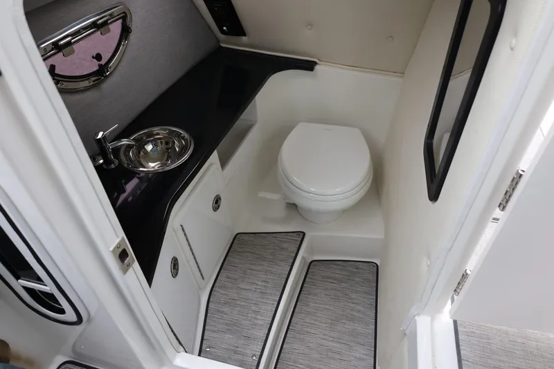 Slide: The Image of 2021 Cobalt R30 boat interior bathroom with sink and toilet. - 60