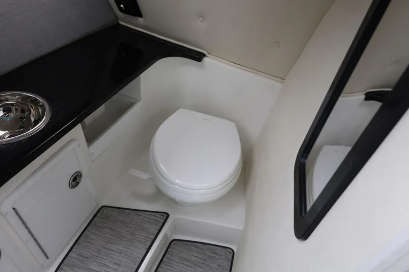 Slide: The Image of 2021 Cobalt R30 boat interior bathroom with toilet and sink. - 62