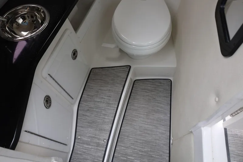 Slide: The Image of 2021 Cobalt R30 boat interior with toilet and sink, featuring modern design elements. - 63