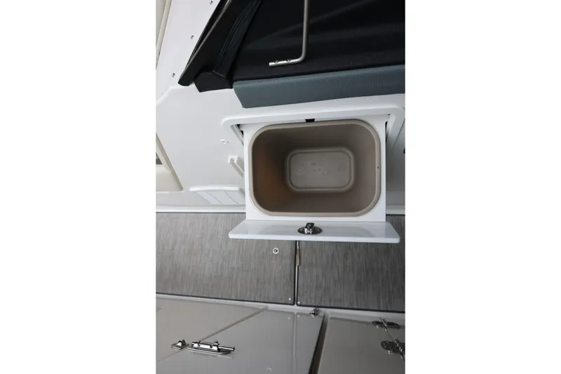 Slide: The Image of Open storage compartment in 2021 Cobalt R30 boat interior. - 66