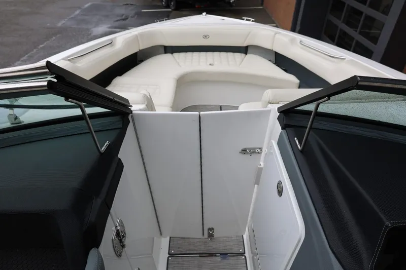Slide: The Image of 2021 Cobalt R30 boat interior with white seating and open windshield. - 67