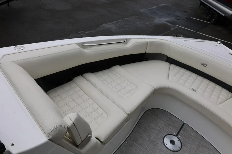 Slide: The Image of Luxurious seating area on a 2021 Cobalt R30 boat, featuring elegant white upholstery. - 68