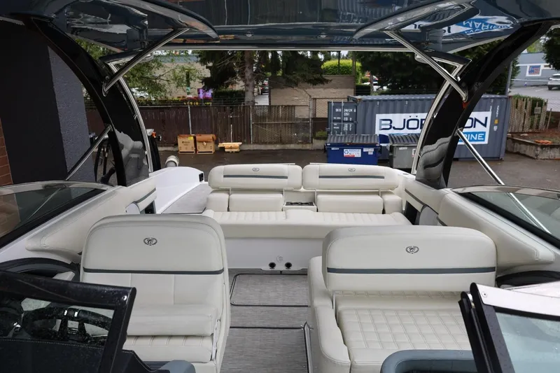 Slide: The Image of Interior view of a 2021 Cobalt R30 boat with luxurious white seating. - 76
