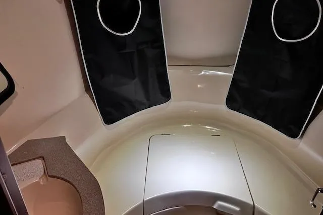 Slide: The Image of Interior cabin of a 1996 Hunter 430 sailboat, featuring seating and storage areas. - 3