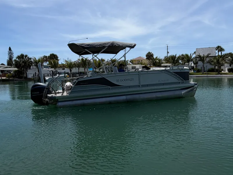 The Image of 2021 Godfrey Marine Monaco pontoon boat on calm water. - 1