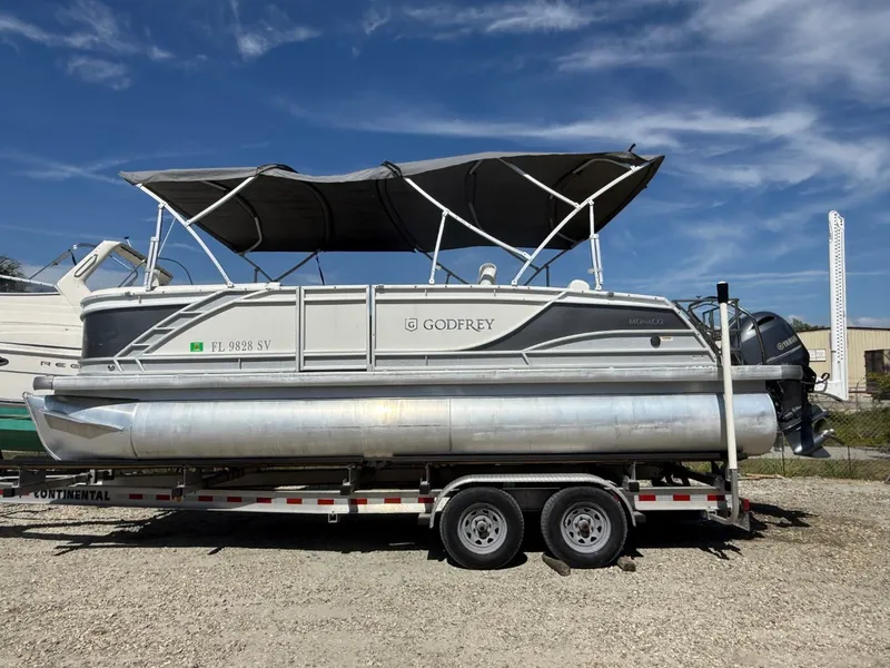 Slide: The Image of 2021 Godfrey Marine Monaco pontoon boat on trailer. - 12