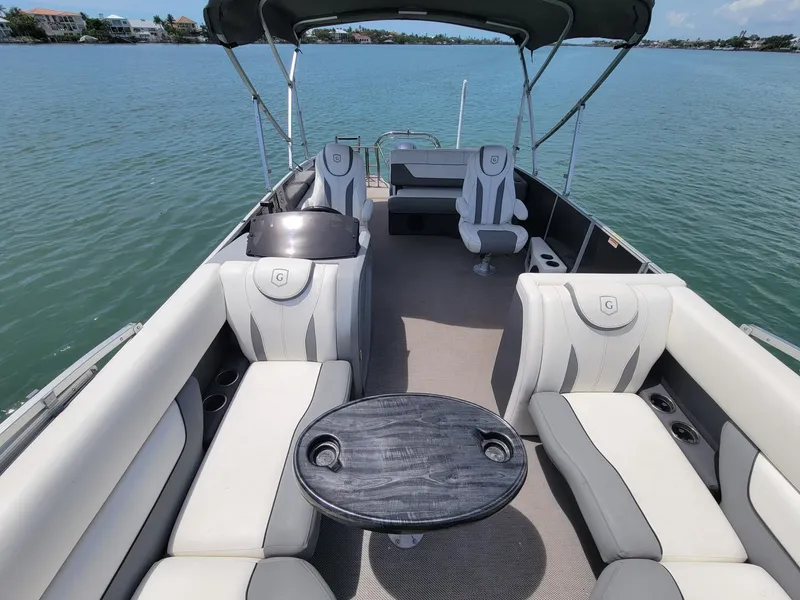 Slide: The Image of Interior view of a 2021 GODFREY MARINE Monaco pontoon boat on the water. - 6