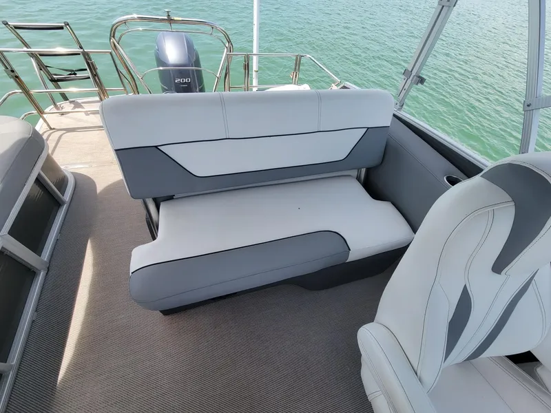 Slide: The Image of Interior of a 2021 GODFREY MARINE Monaco boat with gray seating. - 7