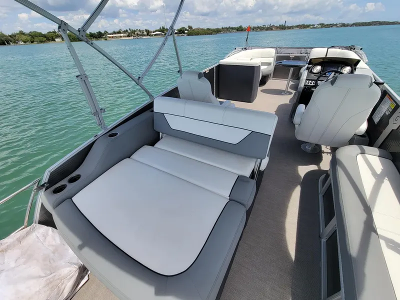 Slide: The Image of 2021 Godfrey Marine Monaco pontoon boat on calm waters. - 9