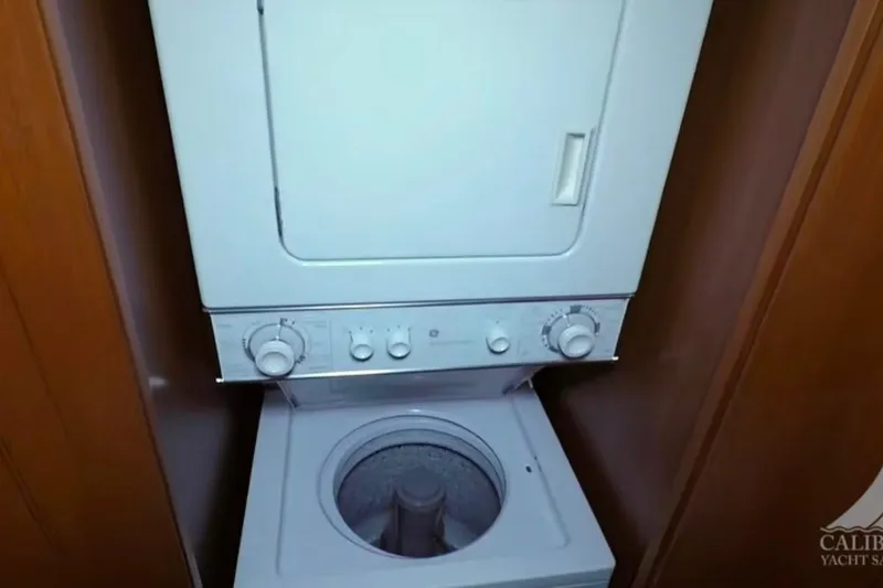 Slide: The Image of Stacked washer and dryer in 2003 Jefferson Pilothouse 53 yacht interior. - 12