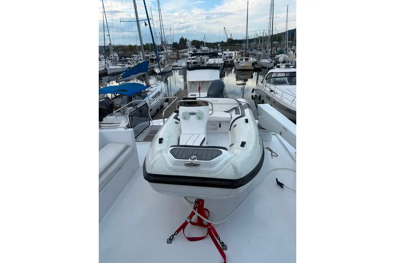 Slide: The Image of 2003 Jefferson Pilothouse 53 yacht with inflatable boat on deck, docked in marina. - 18
