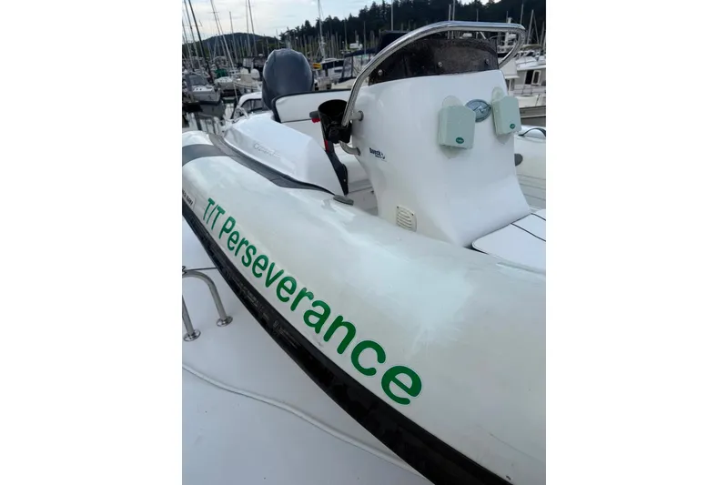 Slide: The Image of 2003 Jefferson Pilothouse 53 boat named "TT Perseverance" docked in a marina. - 21