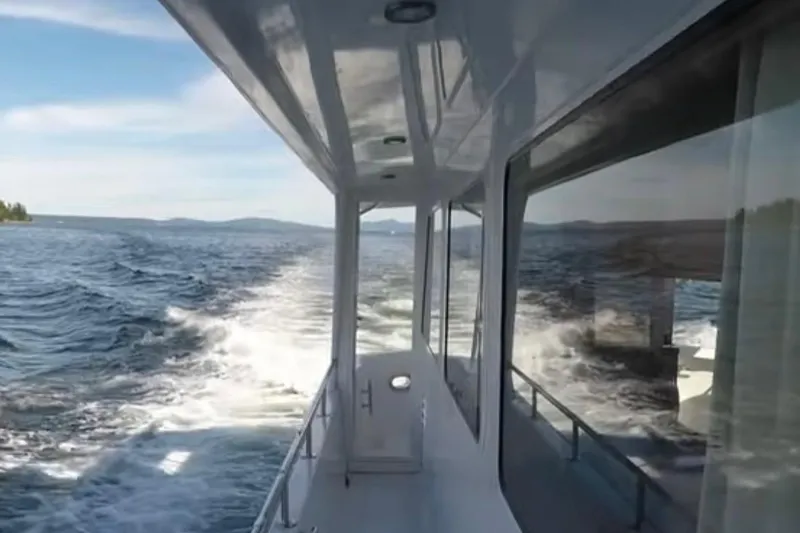 Slide: The Image of 2003 Jefferson Pilothouse 53 cruising on open water, view from deck. - 3