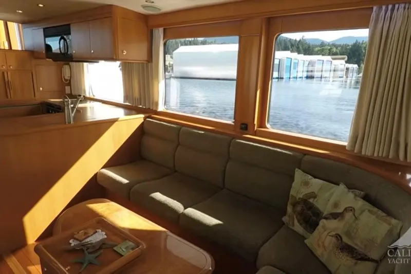 Slide: The Image of Luxurious interior of 2003 Jefferson Pilothouse 53 yacht with scenic water view. - 4