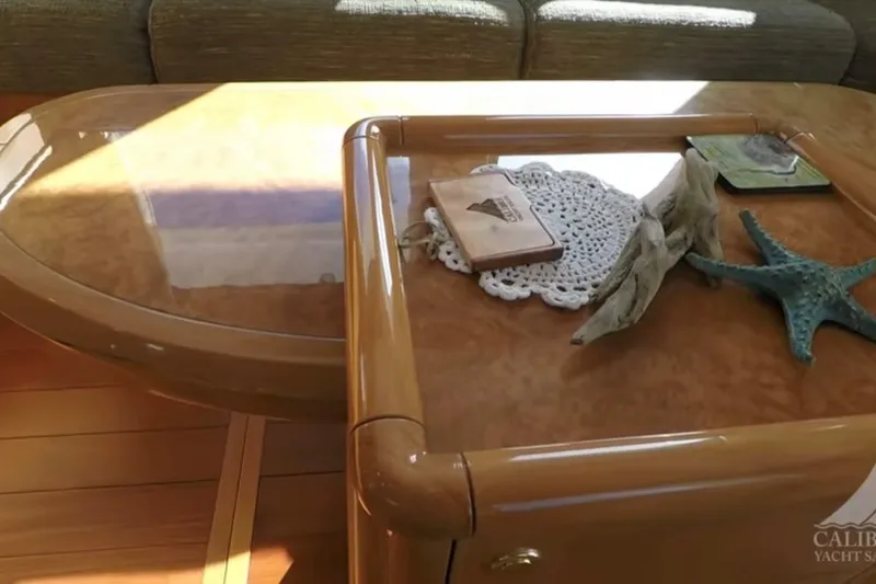 Slide: The Image of Luxurious interior of 2003 Jefferson Pilothouse 53 yacht with elegant wooden table decor. - 6