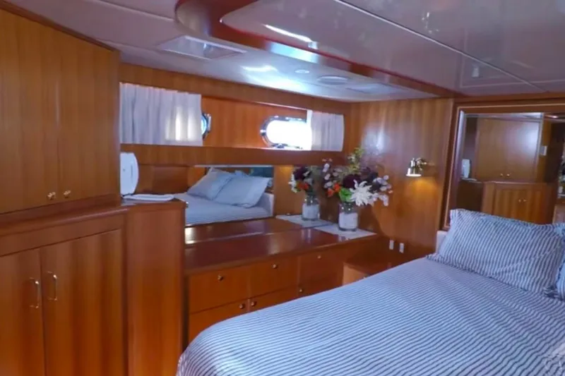 Slide: The Image of Luxurious cabin interior of 2003 Jefferson Pilothouse 53 yacht with elegant wood finish. - 9
