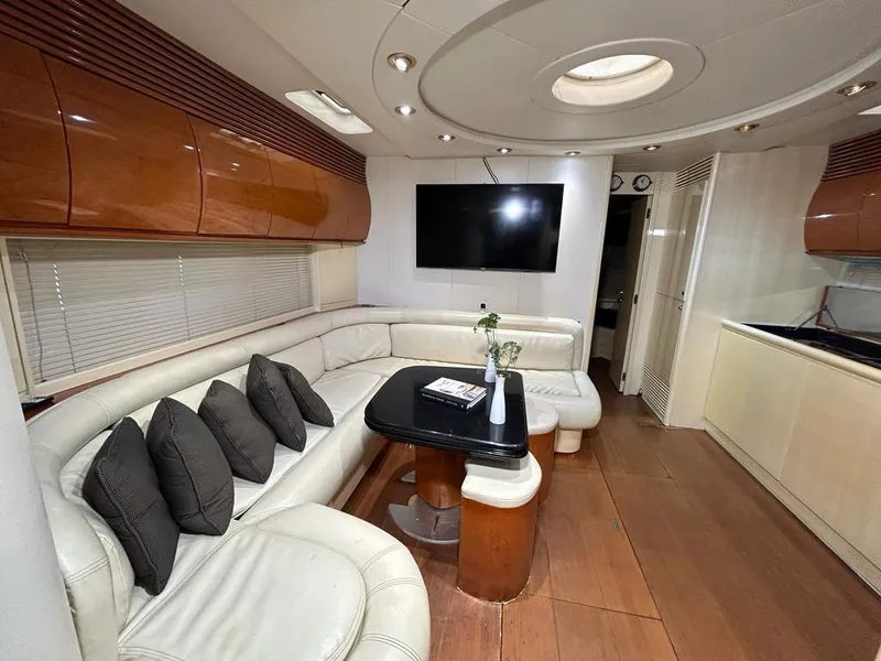Slide: The Image of Luxurious interior of a 1999 Pershing 54 yacht with leather seating and modern amenities. - 24