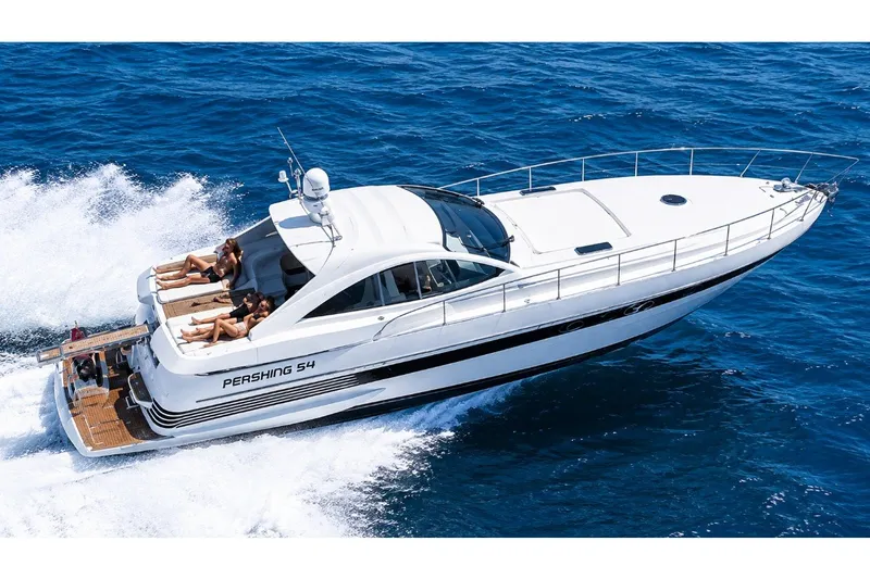 The Image of 1999 Pershing 54 yacht cruising on open sea with passengers sunbathing on deck. - 0