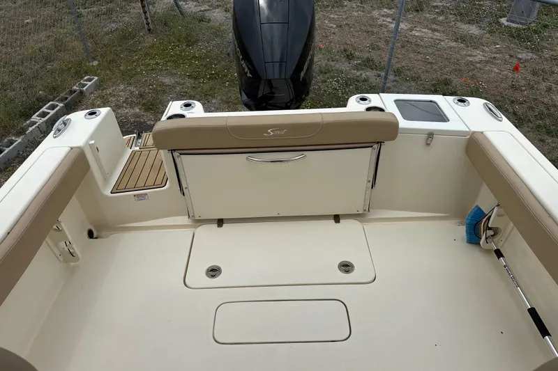 Slide: The Image of 2023 Scout 215 Dorado boat interior with seating and storage compartments. - 10