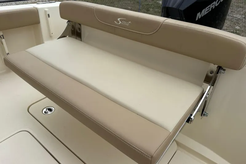 Slide: The Image of 2023 Scout 215 Dorado boat seat with beige upholstery and stainless steel fittings. - 12