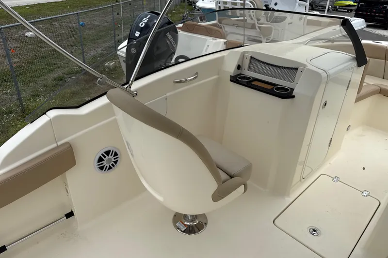 Slide: The Image of 2023 Scout 215 Dorado boat interior with helm seat and console. - 18