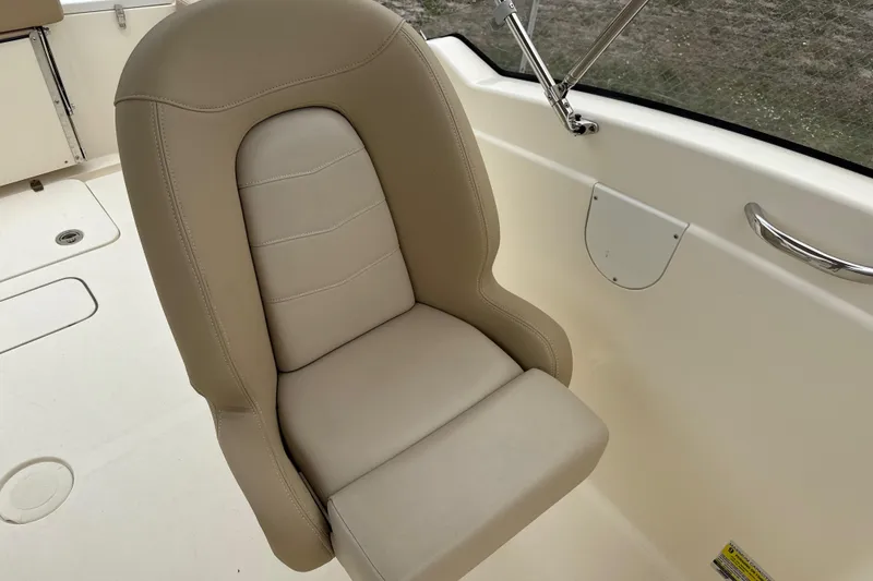 Slide: The Image of Beige seat on 2023 Scout 215 Dorado boat, featuring sleek design and comfortable upholstery. - 20