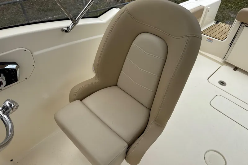 Slide: The Image of 2023 Scout 215 Dorado boat seat, beige leather, sleek design, comfortable marine seating. - 21