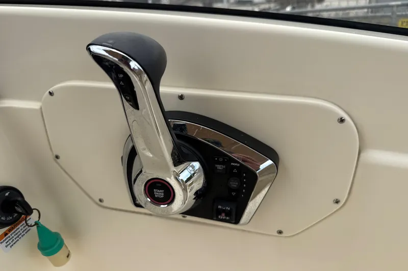 Slide: The Image of Throttle control panel of 2023 Scout 215 Dorado boat, featuring start/stop button. - 23