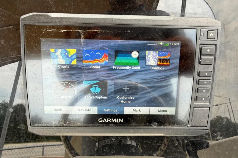 Slide: The Image of Garmin marine display on 2023 Scout 215 Dorado, showing navigation and sonar options. - 24