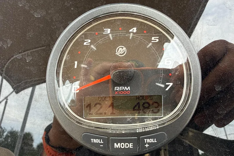 Slide: The Image of Close-up of a 2023 Scout 215 Dorado tachometer displaying RPM and engine hours. - 26