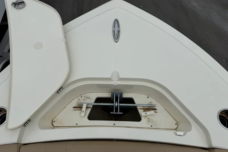 Slide: The Image of 2023 Scout 215 Dorado boat anchor compartment with open hatch, showcasing storage area. - 37