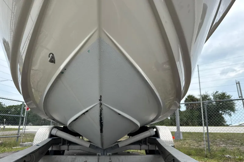 Slide: The Image of 2023 Scout 215 Dorado boat hull on trailer, close-up view. - 7