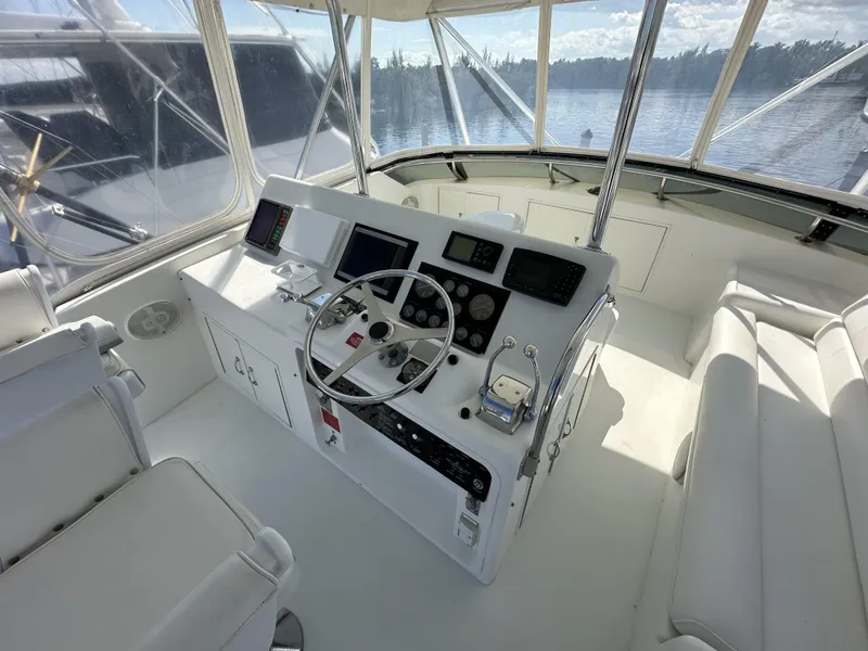 Slide: The Image of Helm station of 1992 Hatteras 50 Convertible yacht with modern navigation equipment. - 45