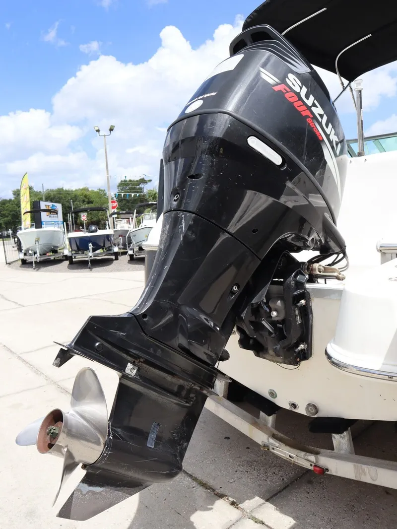 Slide: The Image of Suzuki outboard motor on a 2008 NauticStar 210 DC boat. - 11
