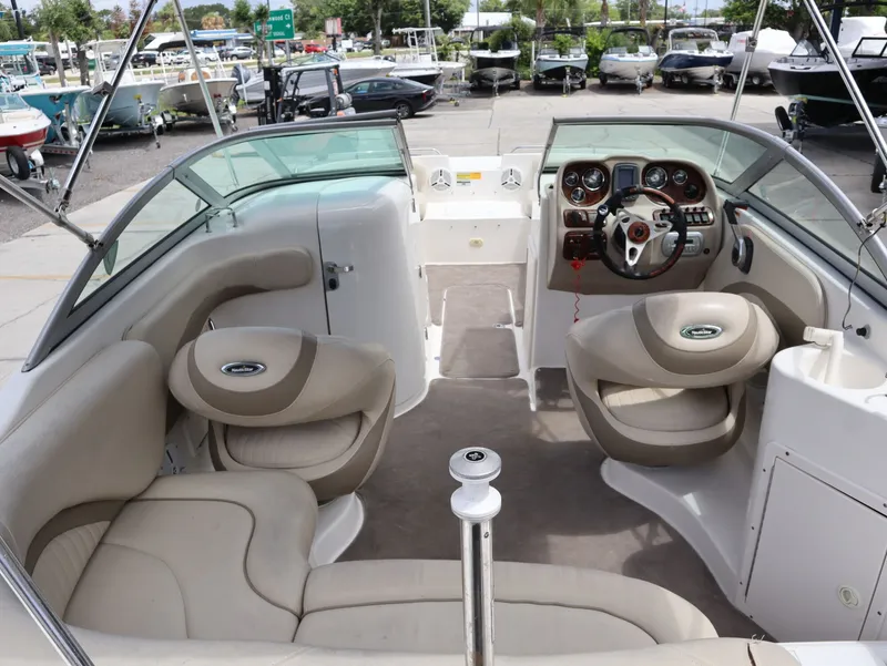 Slide: The Image of Interior of a 2008 NauticStar 210 DC boat with steering wheel and seats. - 12