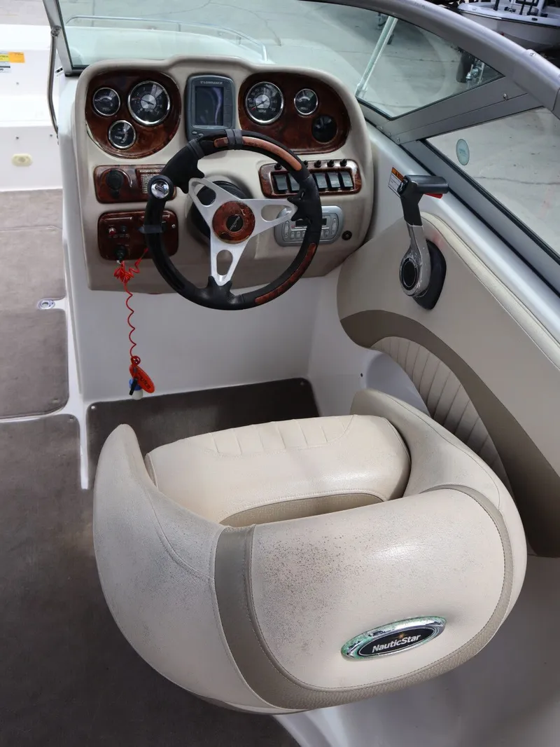 Slide: The Image of Interior of a 2008 NauticStar 210 DC boat with steering console. - 13