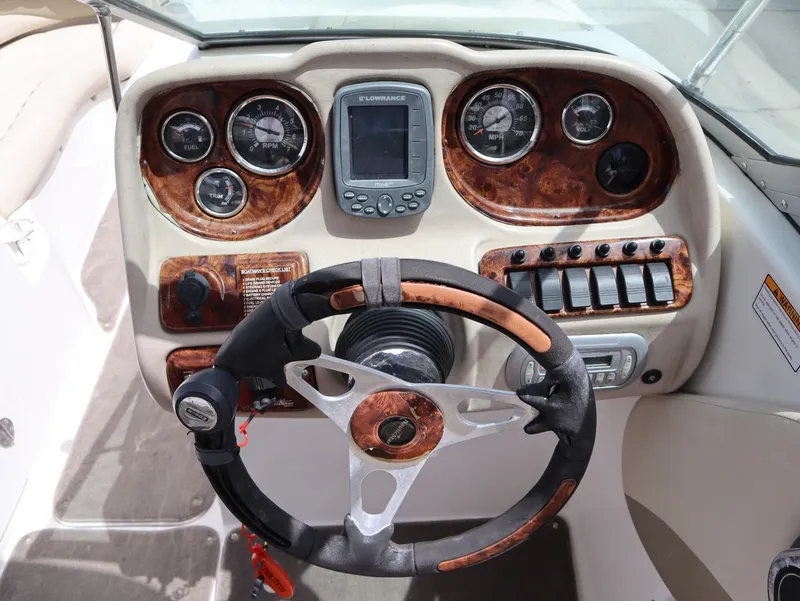 Slide: The Image of Dashboard of a 2008 NauticStar 210 DC boat with wood trim. - 14